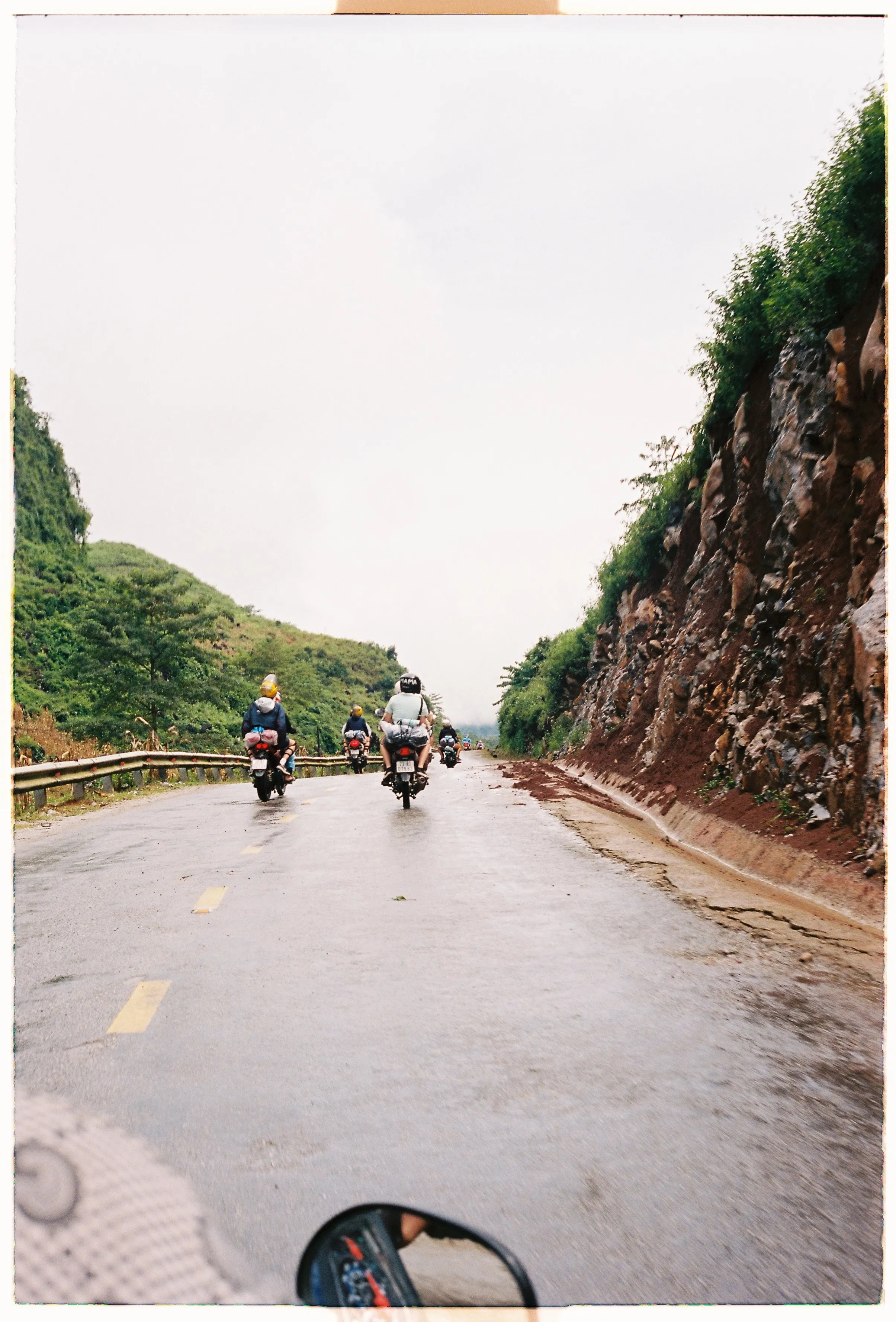 Film photograph from Vietnam, titled "back of rider".